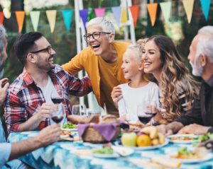 Multi-generation family having a party in the back yard